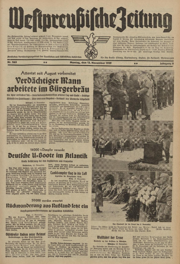 Schwarze-weiß-Titelseite einer deutschen Zeitung vom 13. November 1939 mit der Schlagzeile 'Weitpreubliche Zeitung', die eine Gruppe von Menschen in traditioneller deutscher Tracht in einer feierlichen Atmosphäre zeigt.