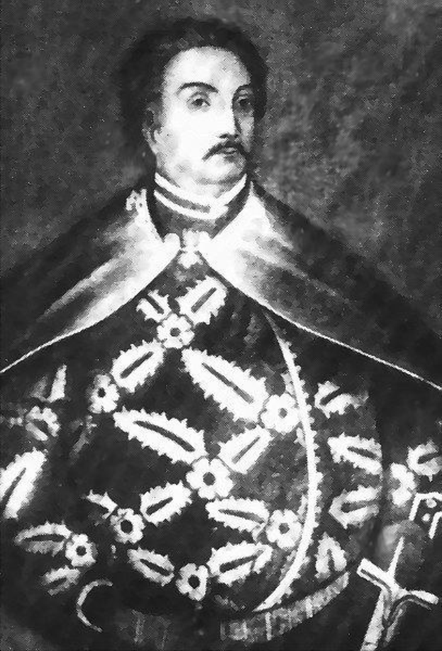Schwarzes und weißes Foto von Papst Johannes Paul II. in Priesterrobe, der eine schwarze Robe mit weißem Kragen und Manschetten trägt und die Hände verschränkt hält, ernsthafter Gesichtsausdruck, direkter Blick.