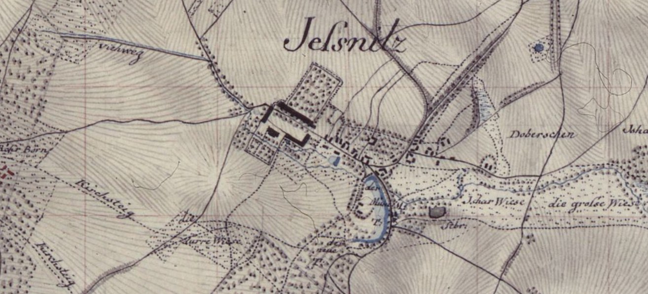 Alte detaillierte Karte von Jelsnitz, Deutschland, mit einem Gebäude in der Mitte und umgeben von Straßen, Gebäuden und Text.