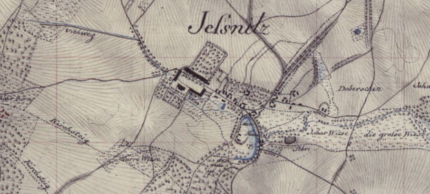 Alte detaillierte Karte von Jelsnitz, Deutschland, mit einem Gebäude in der Mitte und umgeben von Straßen, Gebäuden und Text.