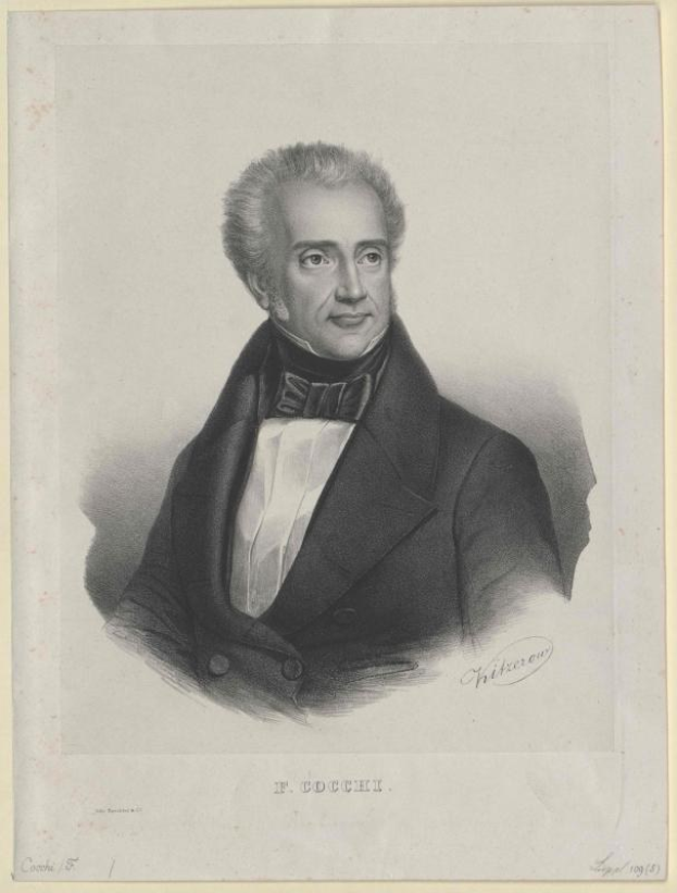 Schwarz-weiß-Porträt des Komponisten F. Cocchi im Smoking, mit der Beschriftung "Die Musik der Oper" unten.